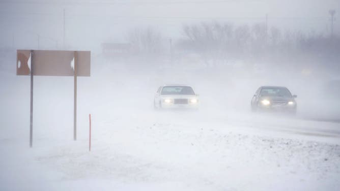 RUDD, IOWA - NOVEMBER 27: Snow blows across a road on November 27, 2019 near Rudd, Iowa. A winter storm, which dumped rain, ice, snow and brought high winds into much of the upper Midwest, has been hampering holiday travel by road and by air on one of the busiest travel days of the year.