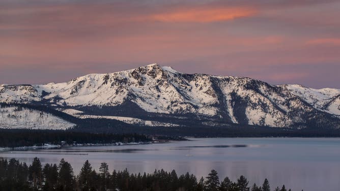 STATELINE, NV - FEBRUARY 12: The California side of South Lake Tahoe is viewed at sunrise from Harvey's Hotel & Casino on February 12, 2024, in Stateline, Nevada.