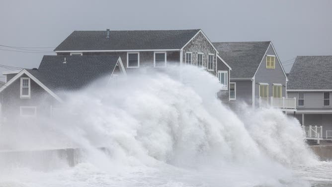 SCITUATE, MASSACHUSETTS - SEPTEMBER 26: Waves crash over homes on Rebecca Road during a nor'easter on September 26, 2026 in Scituate, Massachusetts. A rare September nor'easter is bringing high winds, rough surf and flooding to the area.