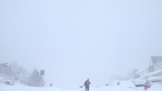 FOREST HILL, MD - JANUARY 23: A man shovels out a car on January 23, 2016 in Forest Hill, Maryland.