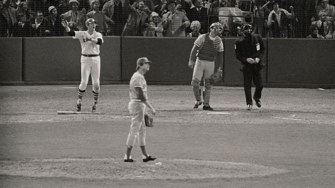 (Original Caption) Carlton Fisk hits the ball in the 12th inning for a home run, winning the game 7-6 and tieing the series 3-3.