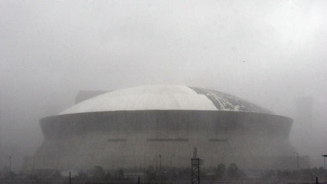 NEW ORLEANS - AUGUST 29: The roof of the Louisiana Superdome is seen damaged due to the strong winds of Hurricane Katrina August 29, 2005 in New Orleans, Louisiana.