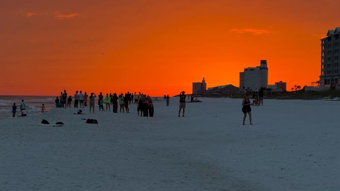 Blood orange sunset over Pensacola Beach, Florida, on Oct. 8, 2026, a day before the expected landfall of Hurricane Isaias.