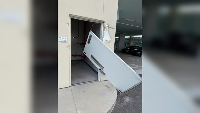 Door ripped away amidst the raw power of Hurricane Isaias in Florida.
