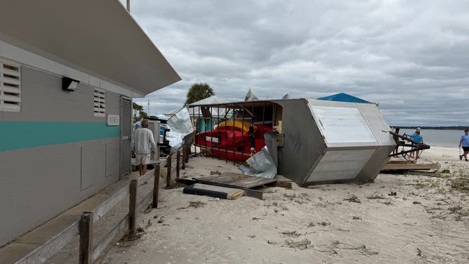 Beach littered with damages in Florida at Pensacola Beach.