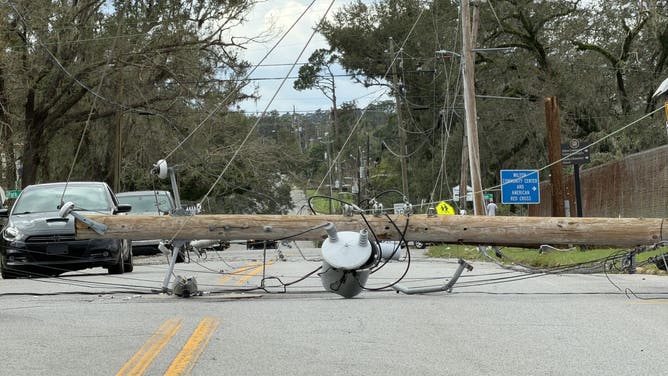 Downed powerline blocking a road in Florida.