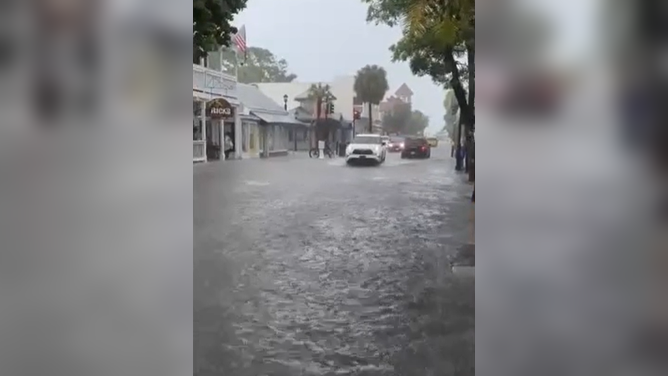 Duval Street in Key West turned into a river Thursday, Oct. 2026, as torrential downpours soaked South Florida. Key West broke a daily rain record that had stood since 1943.